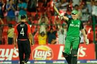 Kevin O'Brien celebrates his century against England.